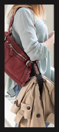 My Fave Jacket Strap holding a jacket on a purse