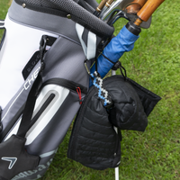 My Fave Jacket Strap holding a jacket on a golf bag