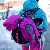 My Fave Jacket Strap holding ski pants on a backpack 